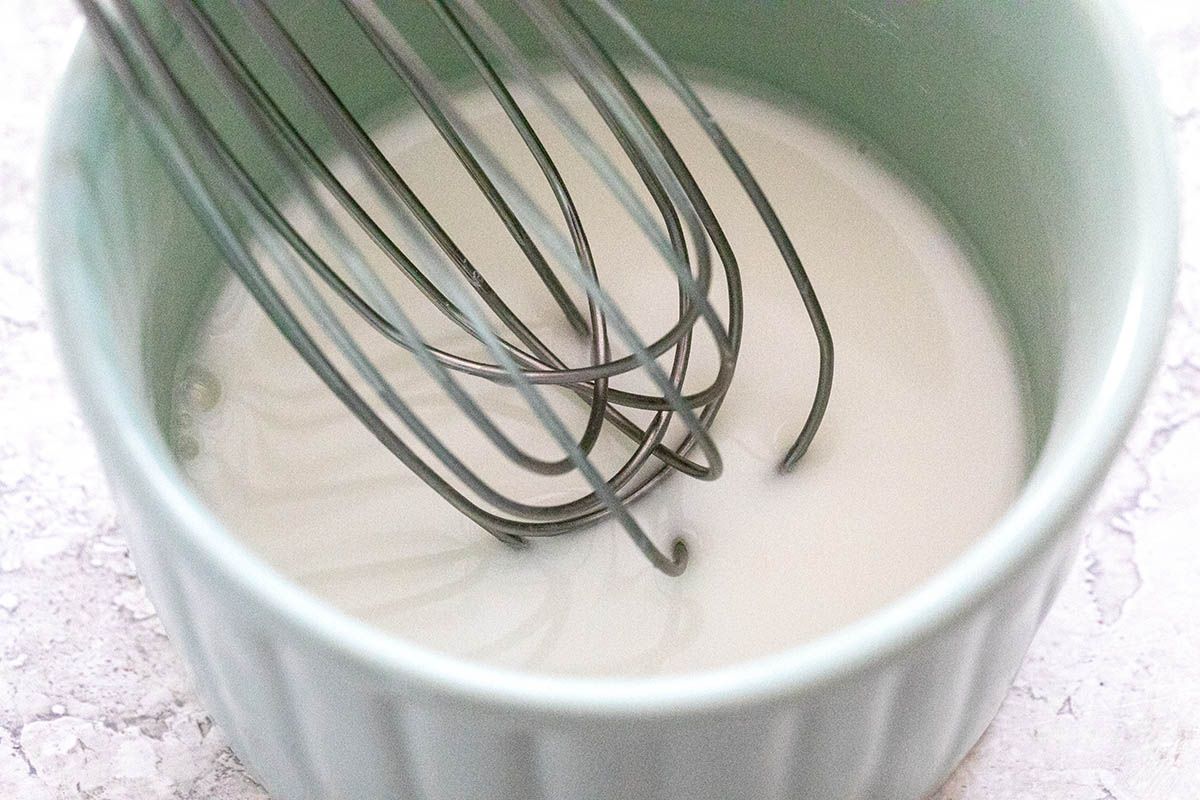 Whisking water and cornstarch to make an Easy Tofu Stir Fry