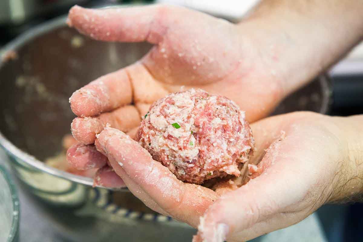 Shape homemade meatballs with your hands