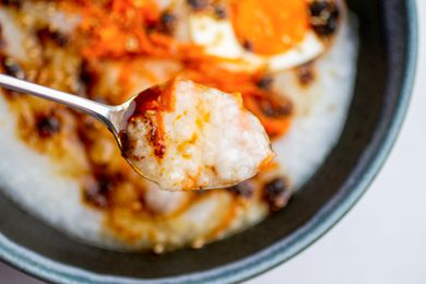 Spoon of jook with toppings