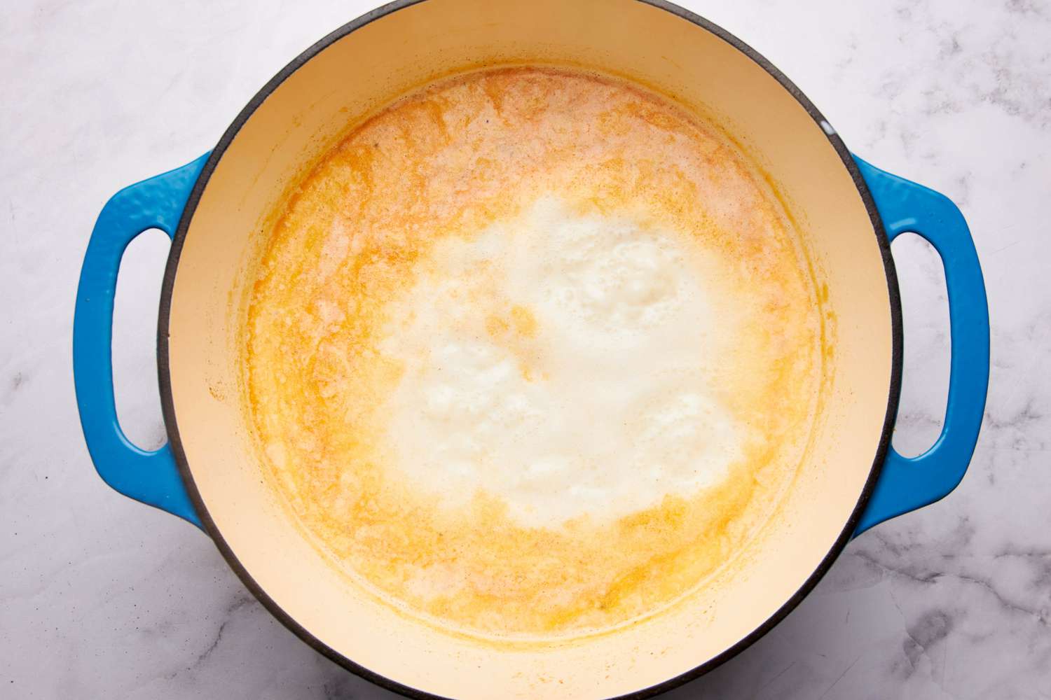 Water and half and half added to the dutch oven for one pot mac and cheese recipe