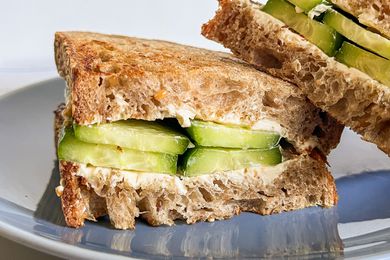 cucumber and cream cheese sandwich on a plate