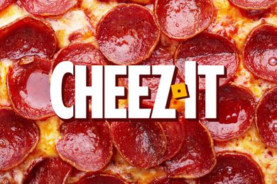 Pizza topped with pepperoni with Cheez-It logo in the center
