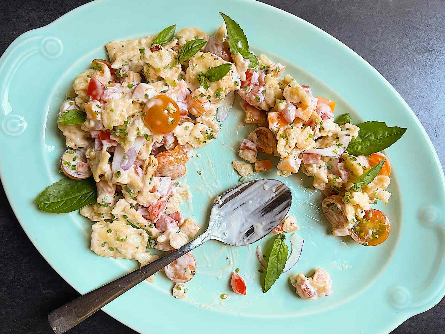 tomato crackers salad on a platter (some already served)
