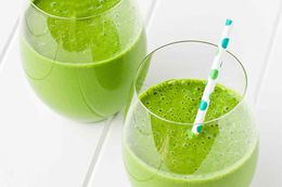 Two glasses with green smoothies