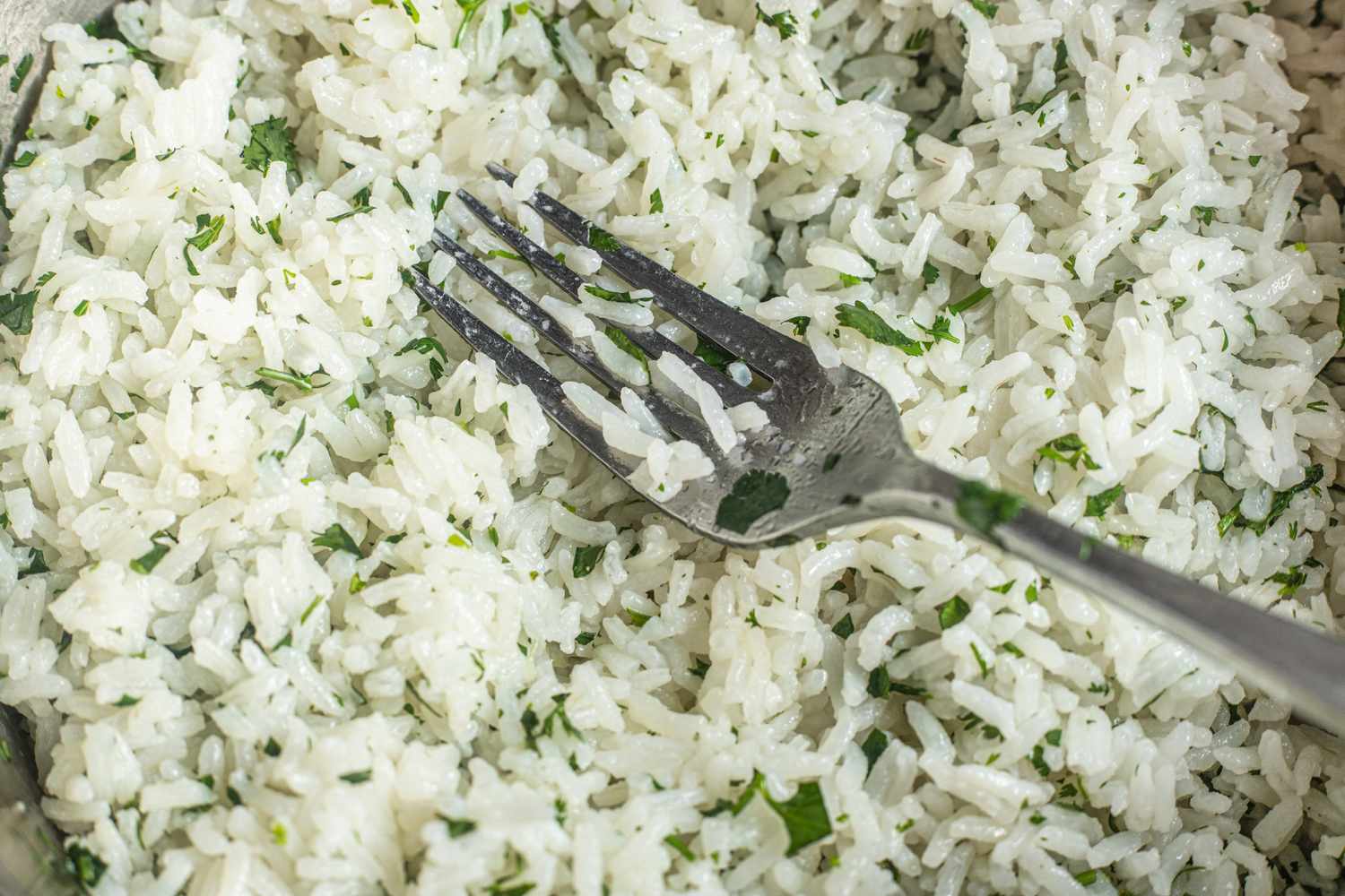Cilantro and Lime Added to Rice to Make Coconut Lime Rice