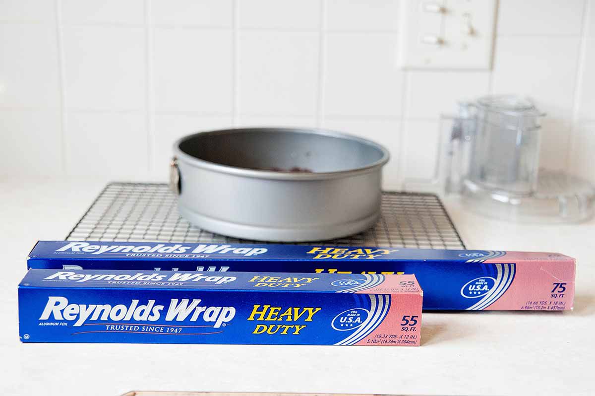 two kinds of aluminum foil infront of a spring form pan.