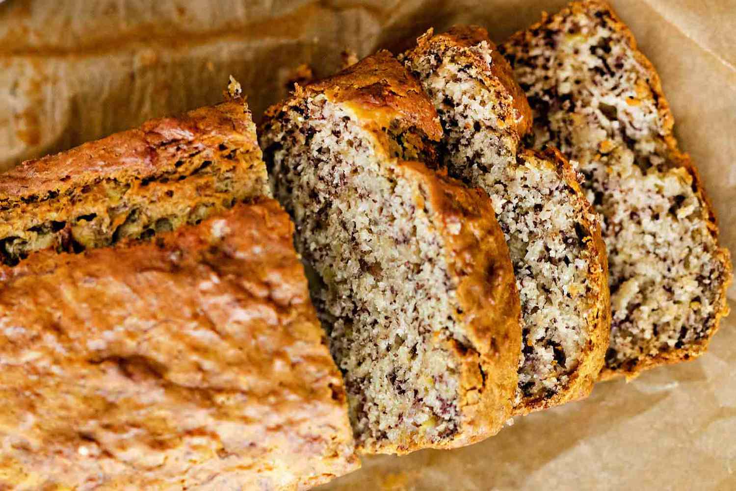 How to Store Banana Bread -- close up of banana bread looking from the top down, half is sliced.