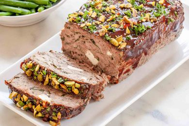 Greek style Meatloaf sliced on a white platter