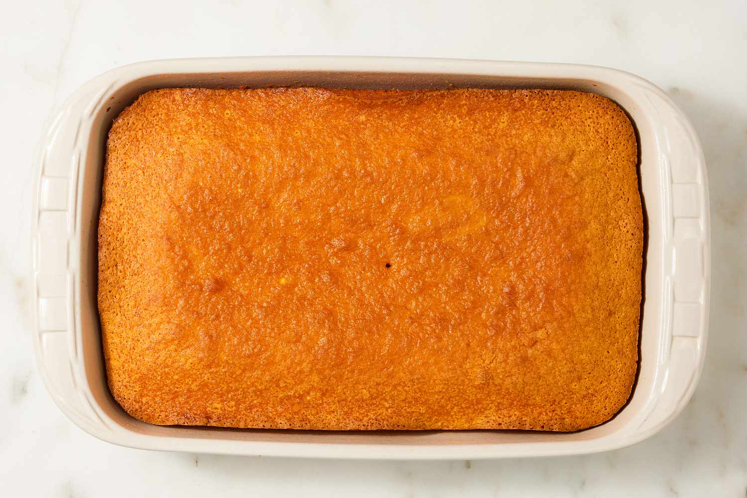 overhead view of cooked sponge of Brazilian Carrot Cake recipe