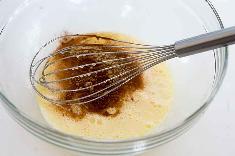 mixing sweet potato pie spices and ingredients