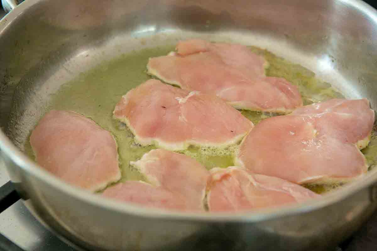 chicken in oil in pot