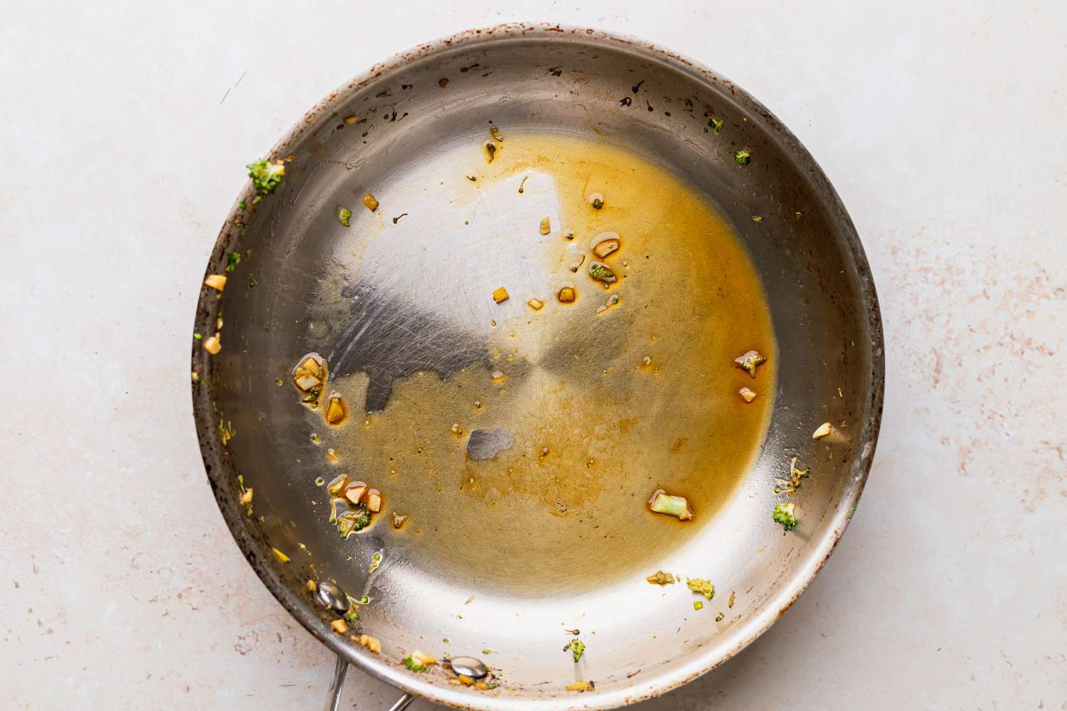 Reducing sauce in a wok to make a broccoli stir fry recipe.