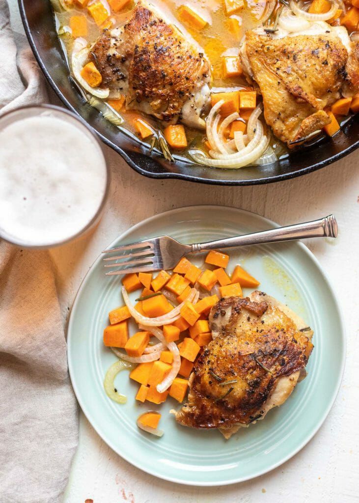 easy weeknight dinner cider-braised chicken thighs in skillet