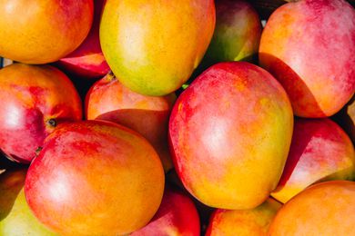 ripe mangoes in a pile
