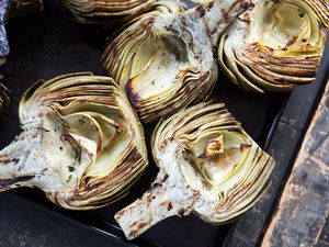 Grilled artichokes on a baking sheet