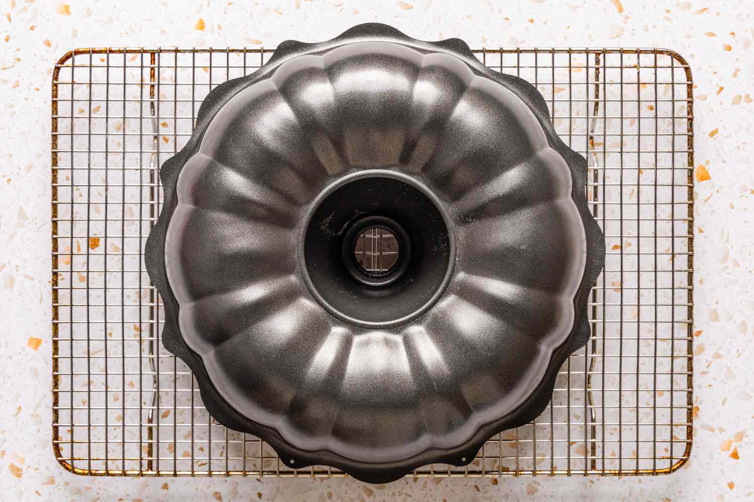 bundt pan flipped upside-down on a wire rack to cool ciambellone