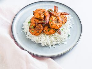Peppery Garlic Shrimp Over Rice on a Plate