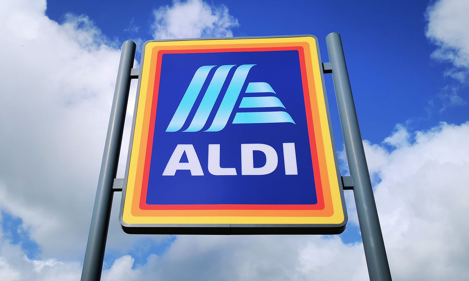 Aldi store sign against a cloudy sky
