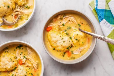 overhead view of Easy Chicken and Dumplings in bowls with spoons