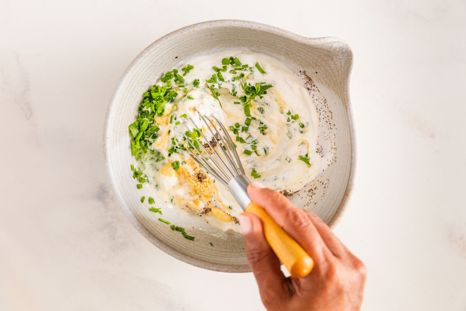 Whisk Used to Mix Sour Cream & Onion Dressing Ingredients in a Bowl for Potato Salad Recipe
