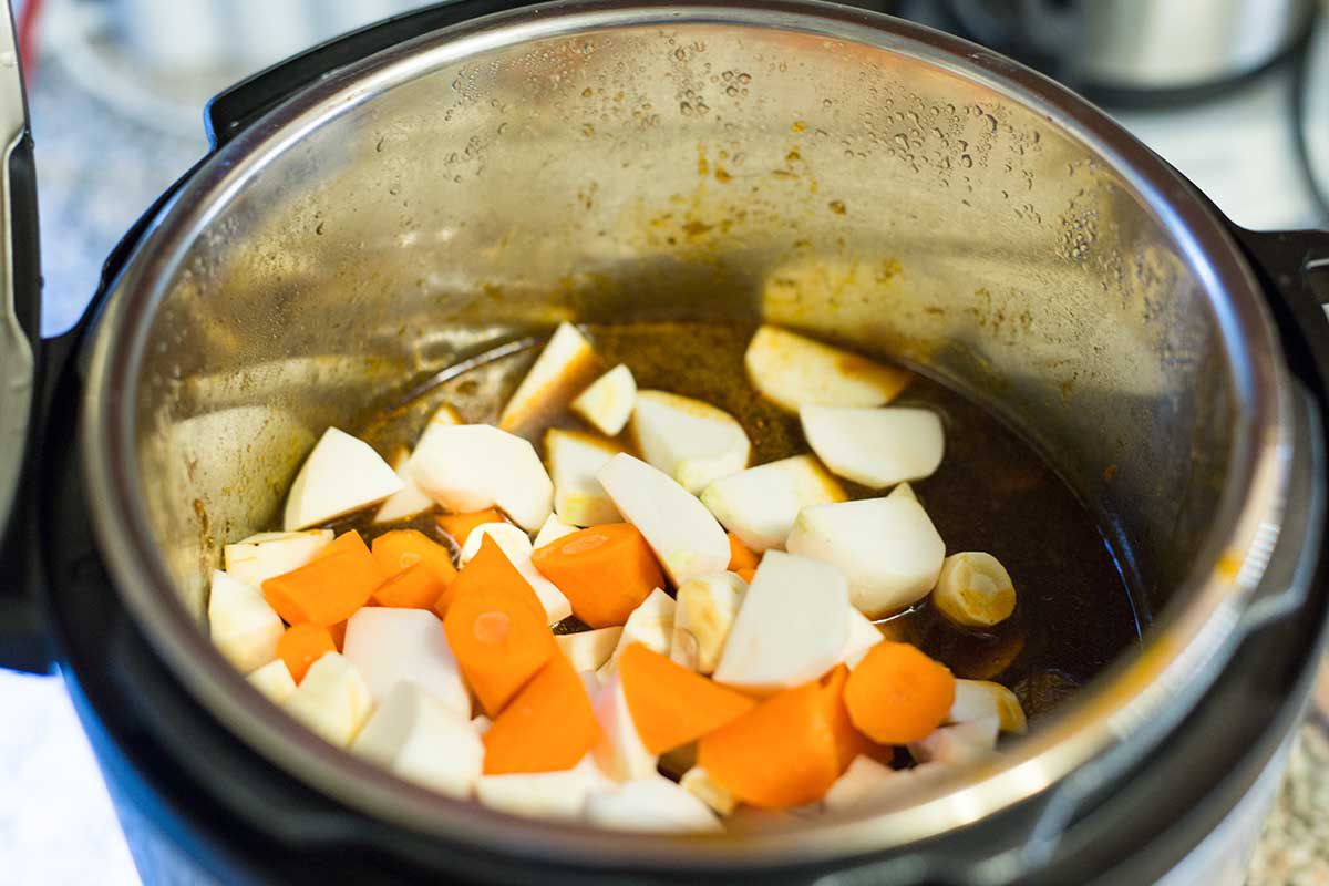 Add the root vegetables to the instant pot for Guinness beef stew