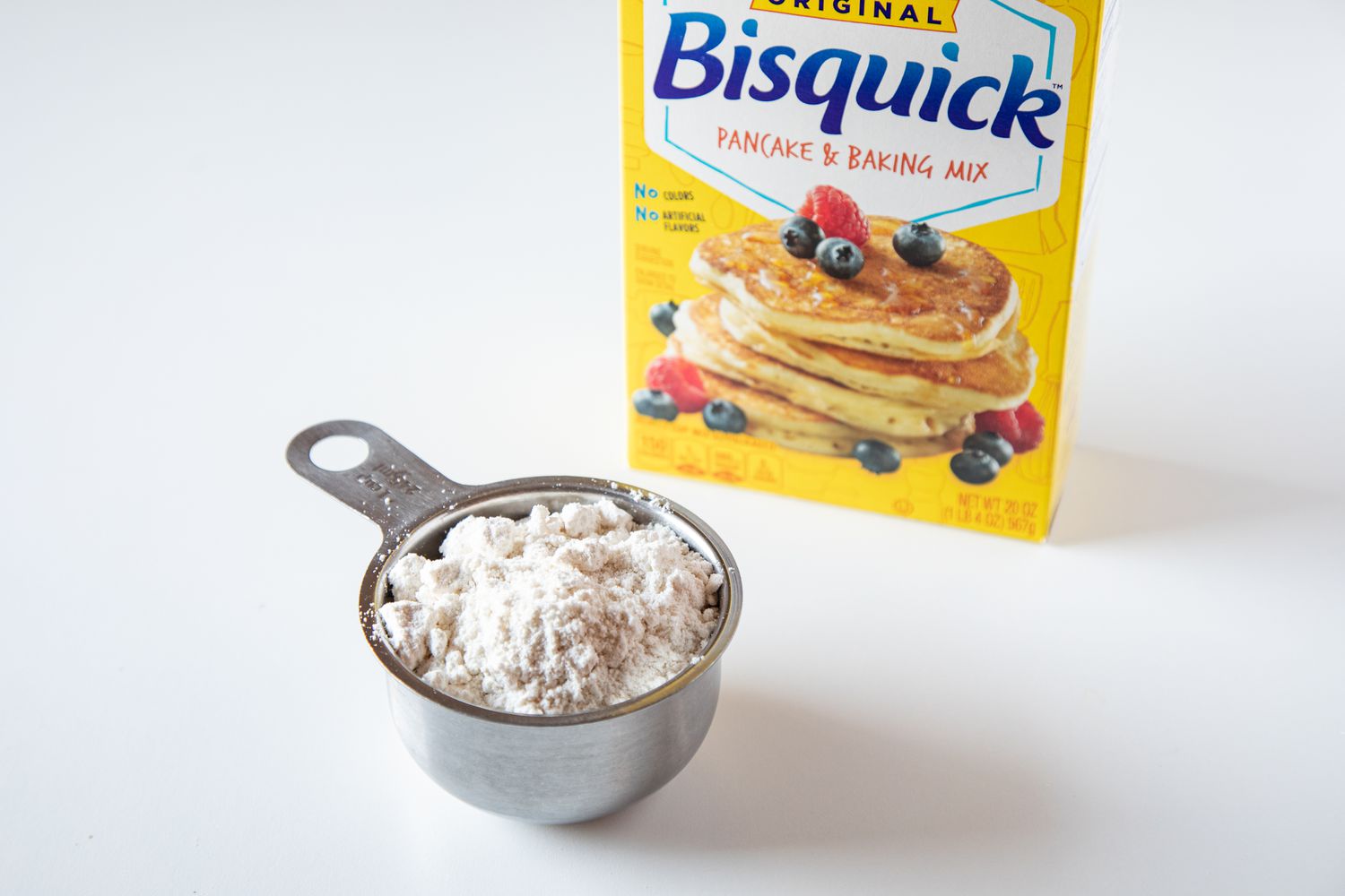 Biquick in a measuring cup to make bisquick coffee cake recipe.