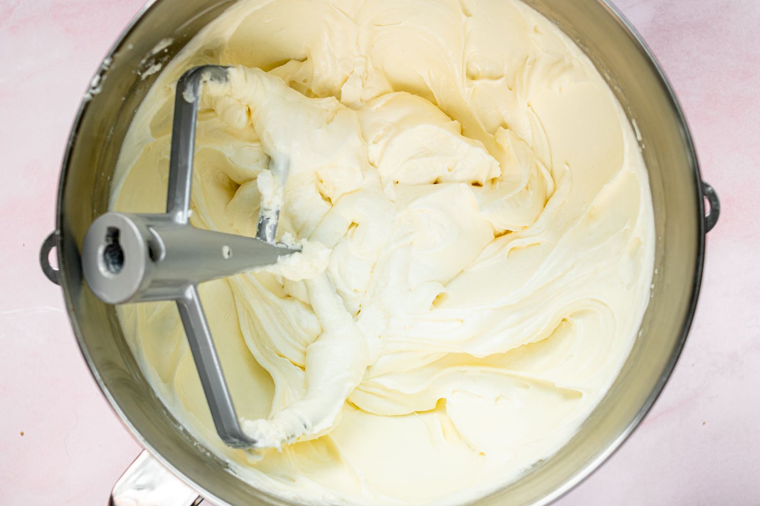 A stand mixer with the cheese cake filling 
