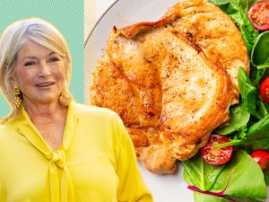 Martha Stewart next to a plate of cooked chicken breast with salad