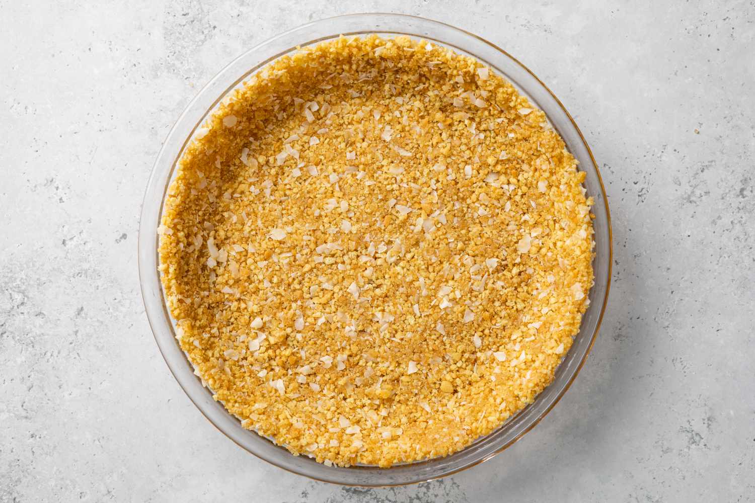 Crumbs Spread Over Pie Pan to Create a Crust