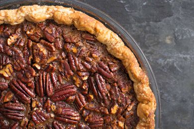 Close up of a baked pecan pie filling.