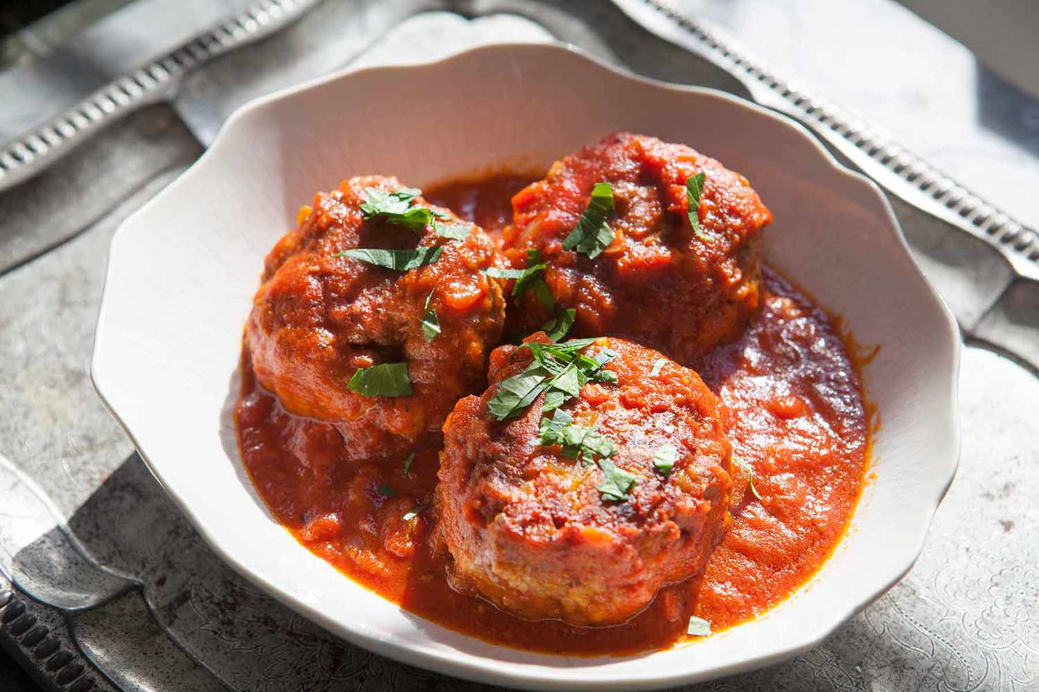 Baked Meatballs in Tomato Sauce served in a bowl