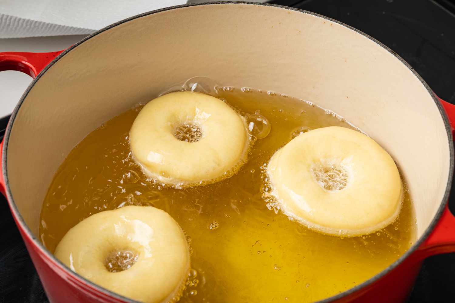 Donuts Fried in a Dutch Oven Filled with Hot Oil