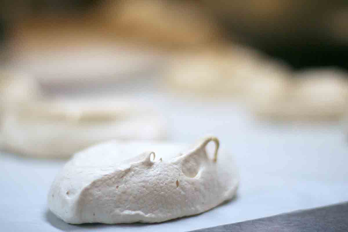 individual pavlova on baking sheet