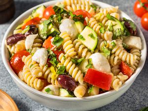 Bowl of pasta salad with vegetables and olives