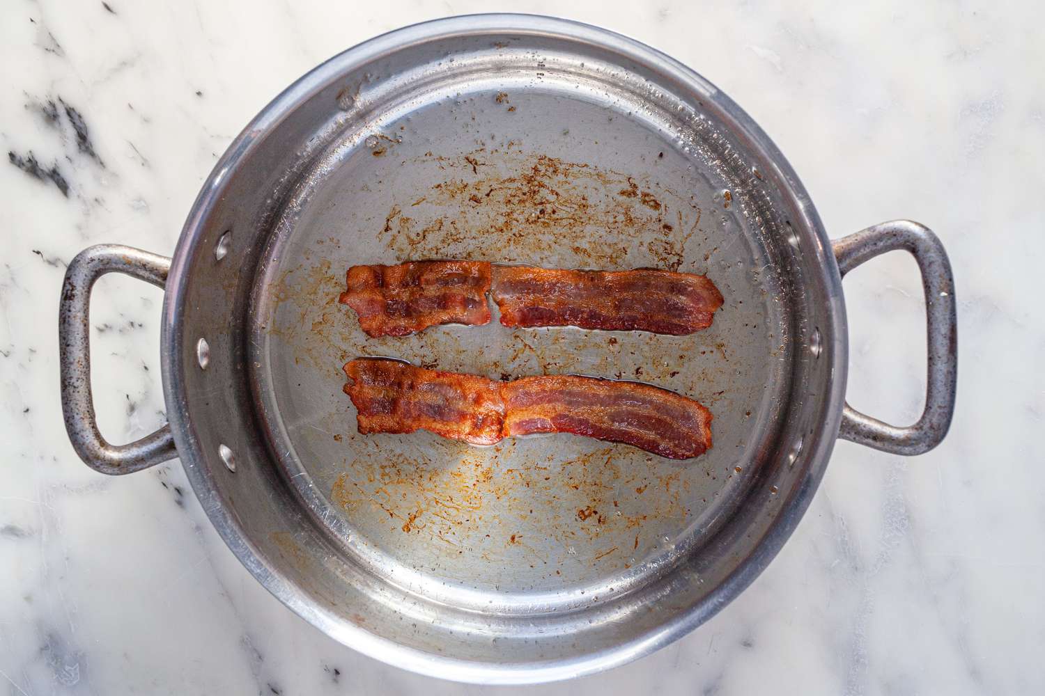 Rendering bacon in a pot for a Manhattan Clam Chowder recipe