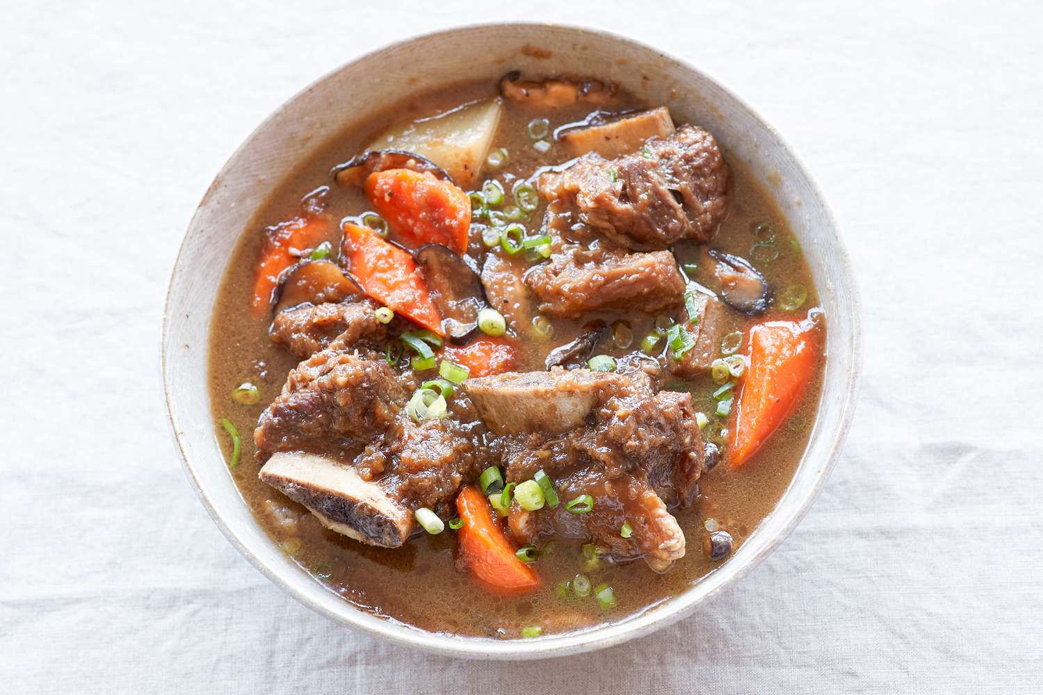 Overhead view of a bowl of sweet and savory Korean braised short ribs