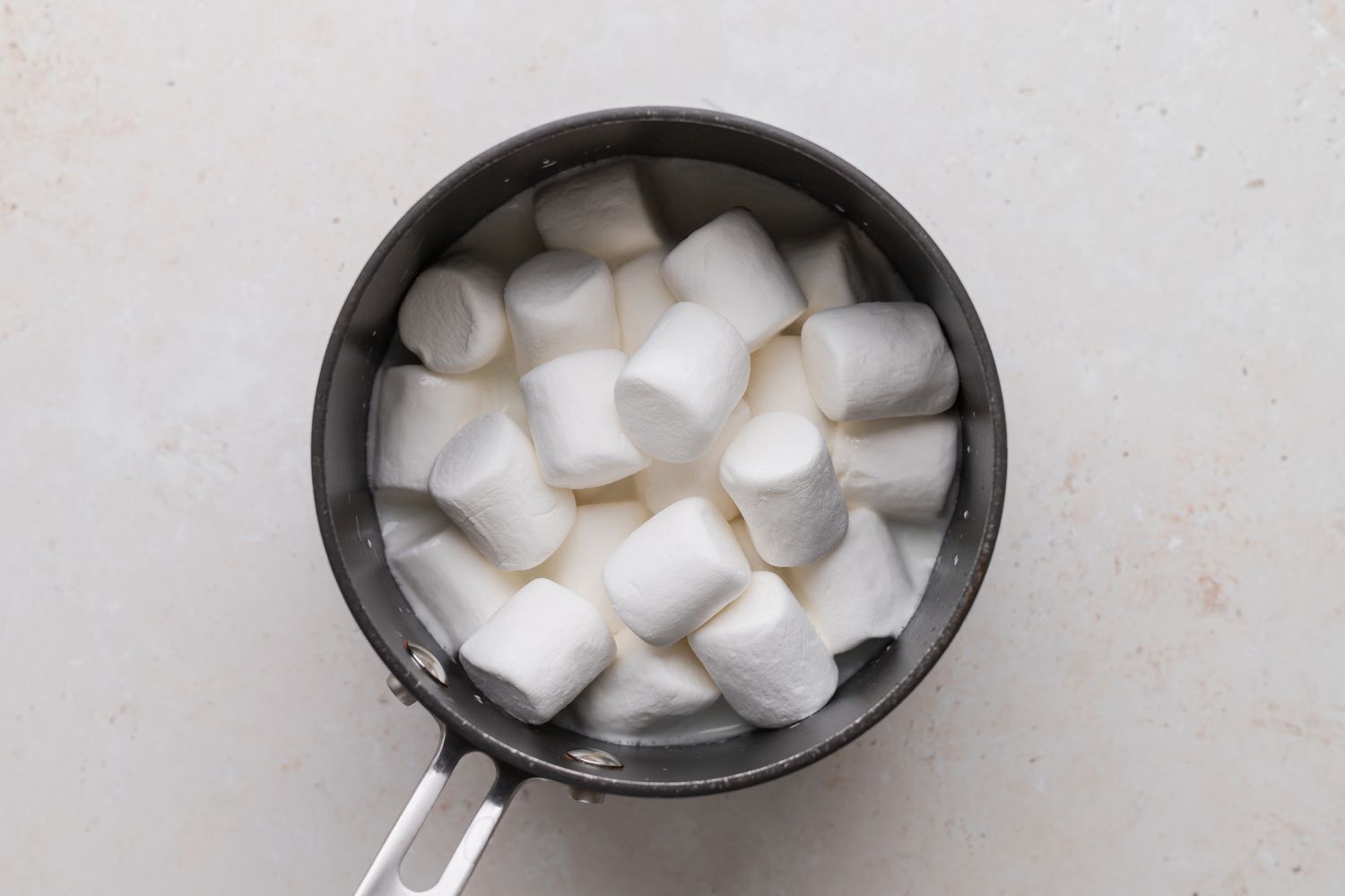 Marshmallows in a pot for a grasshopper pie recipe.