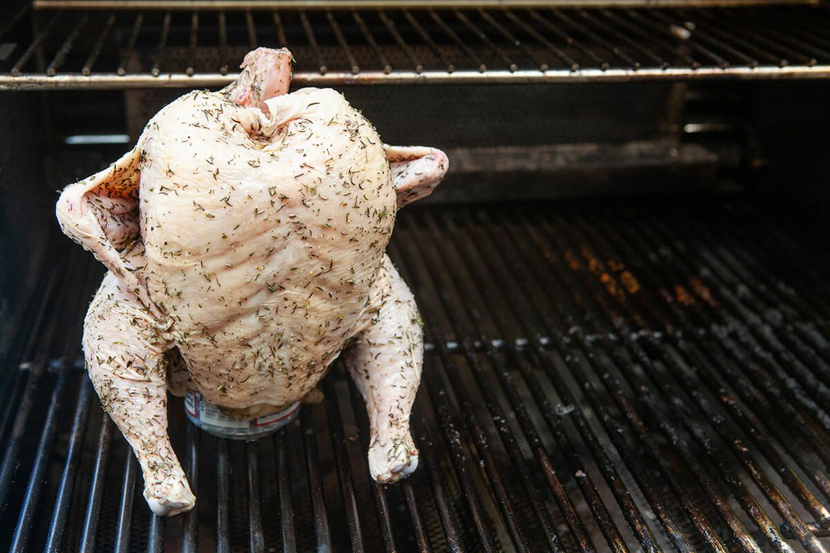 Raw Whole Chicken on a Beer Can on a grill