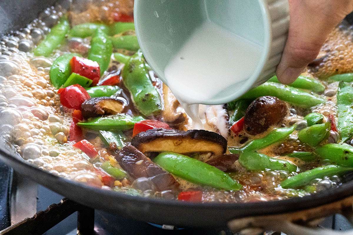 Cornstarch added to a wok for a Vegetarian Stir Fry with Tofu.