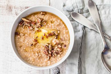 Instant Pot Oatmeal with apples and cinnamon in a bowl with silverware nearby