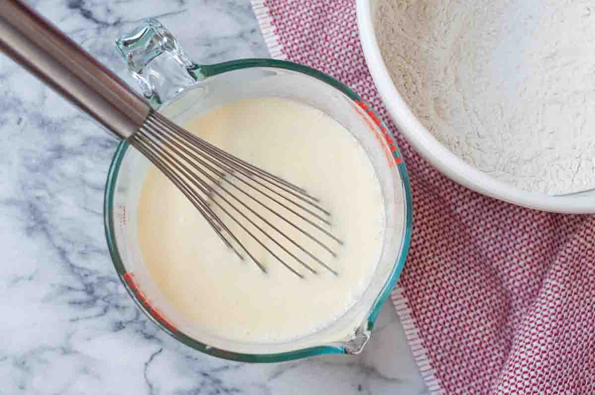 Whisk together the buttermilk, butter, and eggs for the waffle recipe