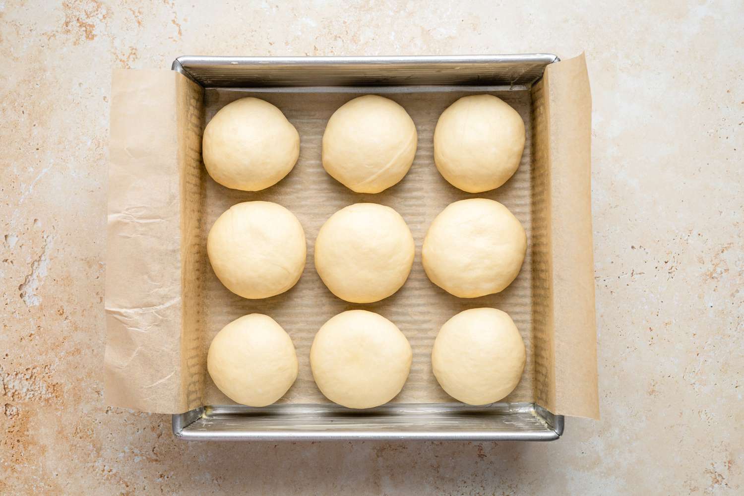 Milk Bread Roll Dough Rising in Baking Pan 
