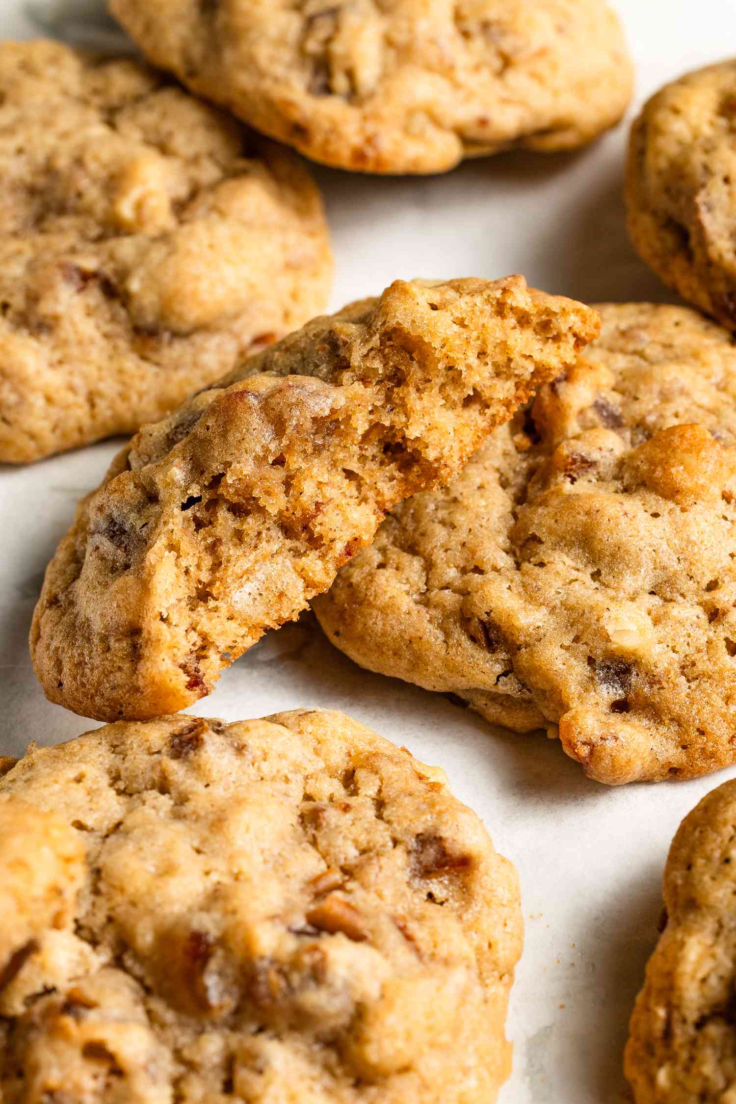 Old-fashioned hermit cookies on the counter (one cookie broken in half)