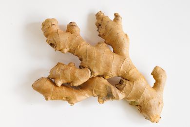 A piece of ginger root on a white background