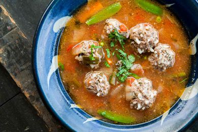 Albondigas Soup (Mexican Meatball Soup) in a blue bowl