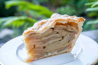 mile high apple pie on serving plate