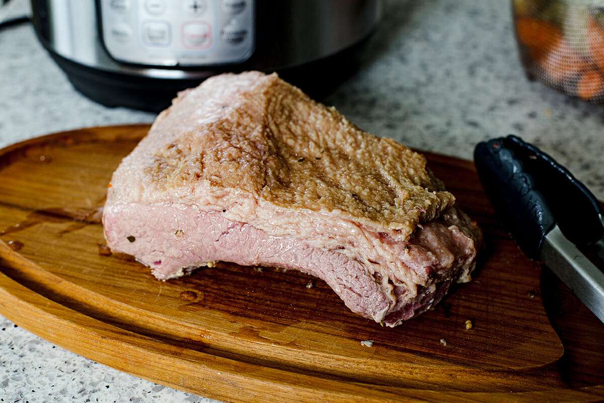 How to Cook Corned Beef and Cabbage in the Pressure Cooker - corned beef on cutting board
