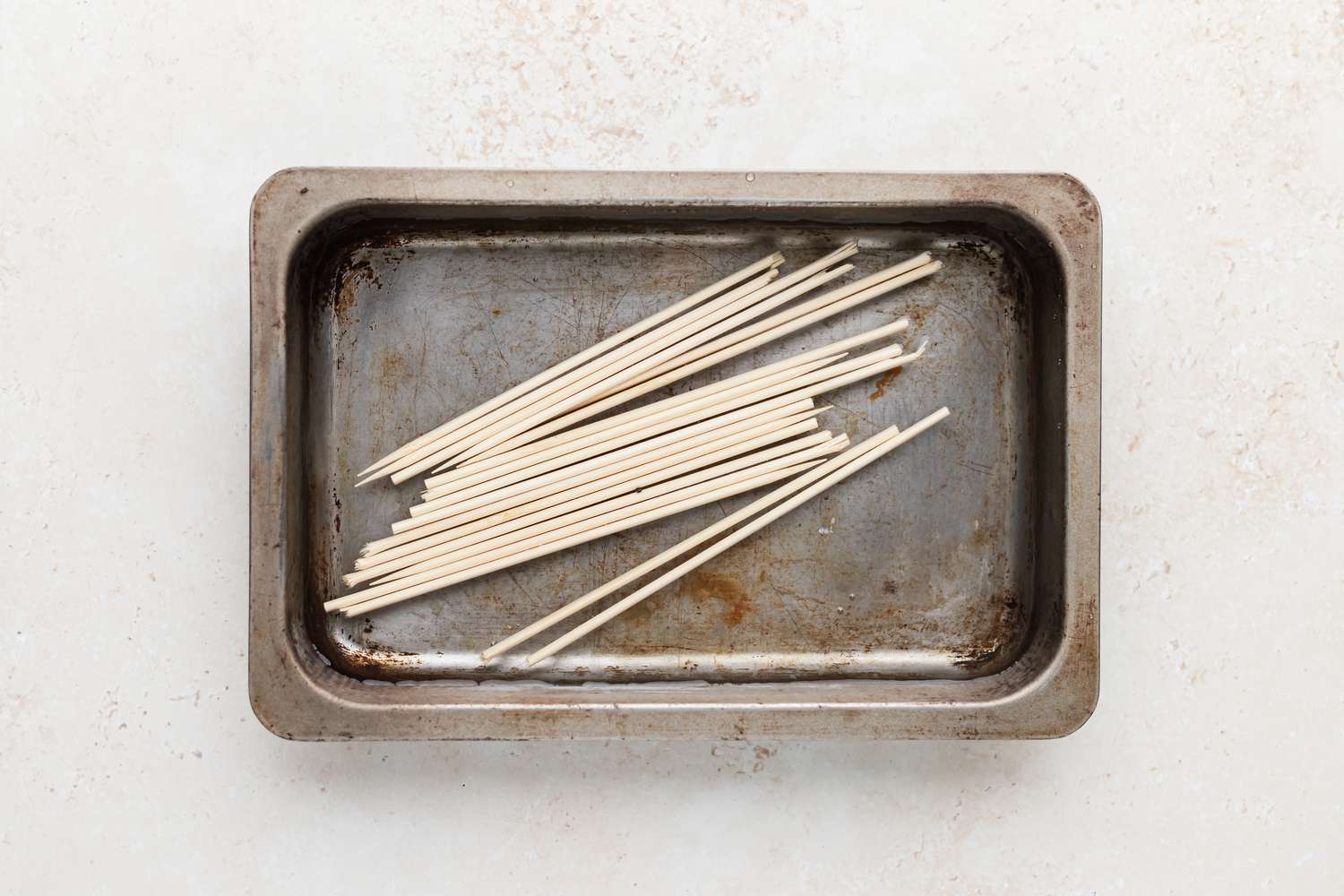 Soaking skewers to make shish kabobs.