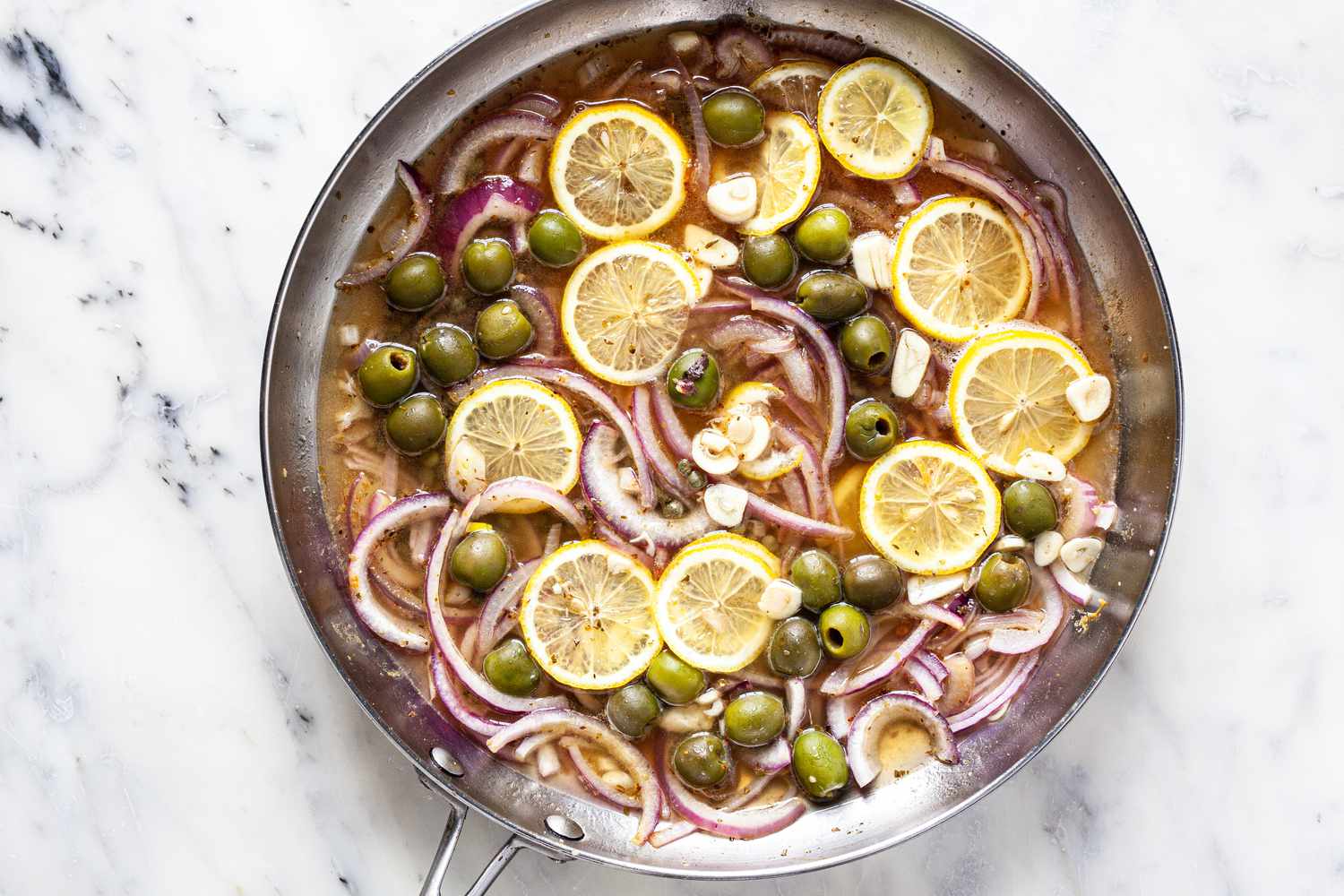 Cook capers, olives, lemons, and red onions. 