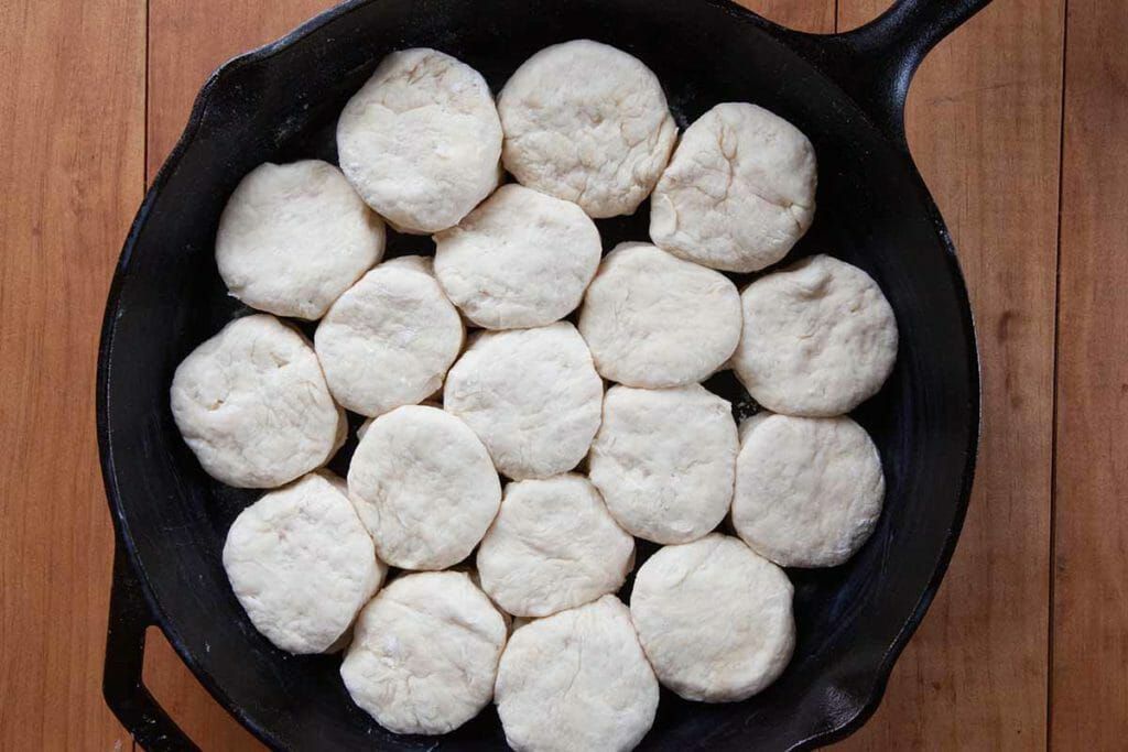 Place angel biscuits in pan making sure they touch